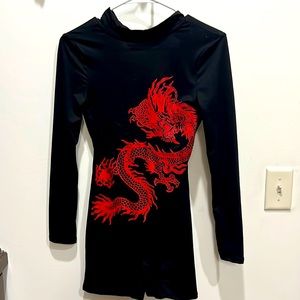 NWT. Fashion nova black romper with Dragon design. Never worn.
